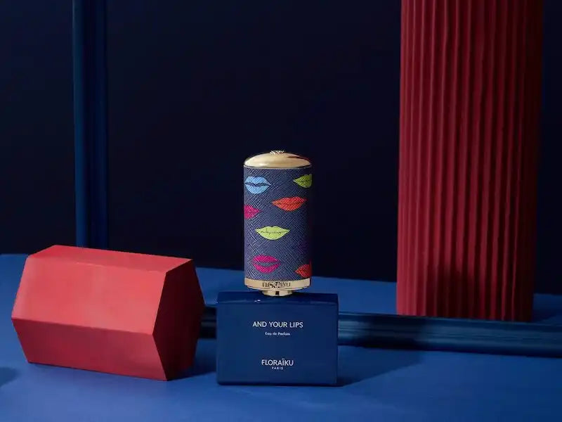 Decorative cylindrical container with colorful lip patterns on a navy blue base.