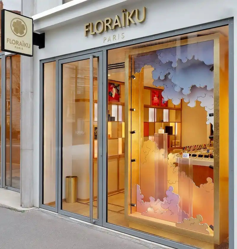 A luxury perfume storefront with a decorative window display.